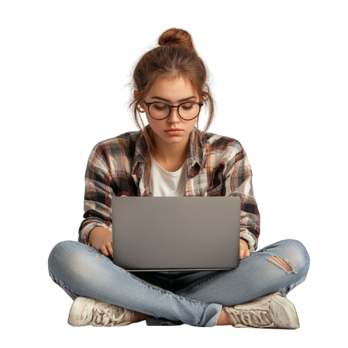 Girl in glasses, sitting criss crossed, coding with her hair up. Girl in glasses, sitting criss crossed, coding with her hair up.